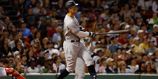 Aaron Judge of the New York Yankees watches his solo home run against the Boston Red Sox at Fenway Park in Boston on Aug. 12, 2022.