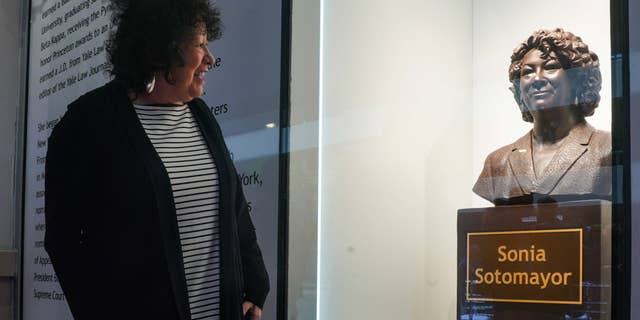 U.S. Supreme Court Justice Sonia Sotomayor admires a bust dedicated to her at Bronx Terminal Market, on Thursday, Sept. 8, 2022, in New York.
