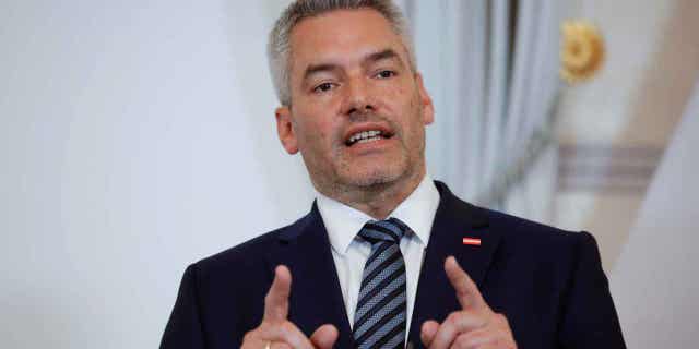 Austrian Chancellor Karl Nehammer, above, addresses the media during a joint press conference with Hungarian Prime Minister Viktor Orban in Vienna, Austria, on July 28, 2022. Austria announced that it will start checks at its border crossings with Slovakia in a move aimed at keeping migrants from entering.