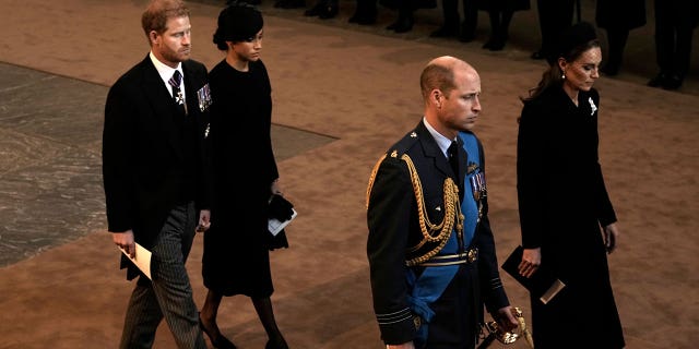 Kate, William, Harry, and Meghan look solemn as they walk out of Westminster Hall