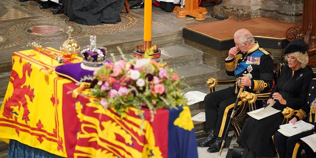 King Charles and Camilla, Queen Consort sat in front of the coffin of Queen Elizabeth II during her state funeral.