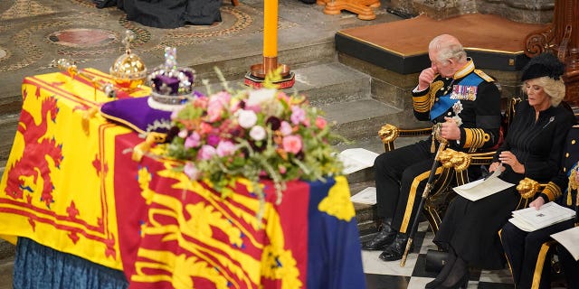 King Charles and Camilla, Queen Consort sat in front of the coffin of Queen Elizabeth II during her state funeral.