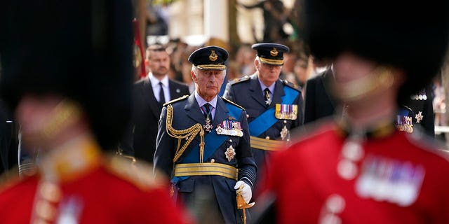 King Charles follows the coffin of Queen Elizabeth II during a procession from Buckingham Palace to Westminster Hall.