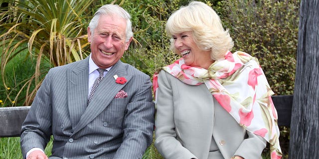 King Charles laughing with wife Camilla
