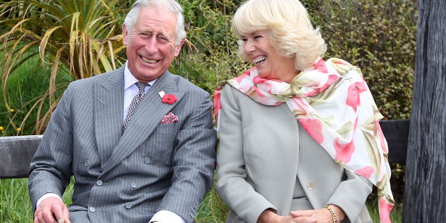 King Charles laughing with wife Camilla