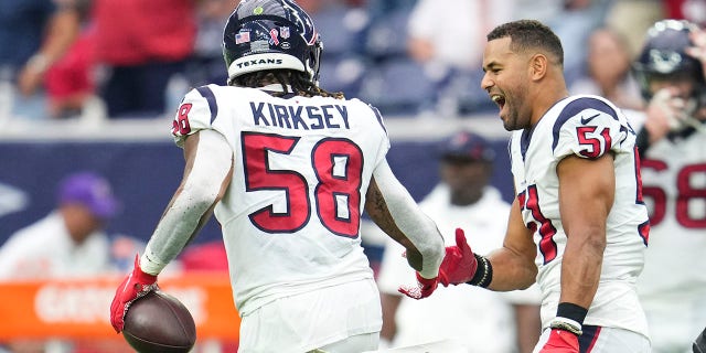 Christian Kirksey (58) of the Houston Texans celebrates with linebacker Kamu Grugier-Hill (51) against the Jacksonville Jaguars during a game at NRG Stadium Sept. 12, 2021, in Houston.