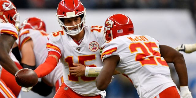 Patrick Mahomes of the Kansas City Chiefs hands the ball off to running back LeSean McCoy against the Los Angeles Chargers on Nov. 18, 2019, in Mexico City.
