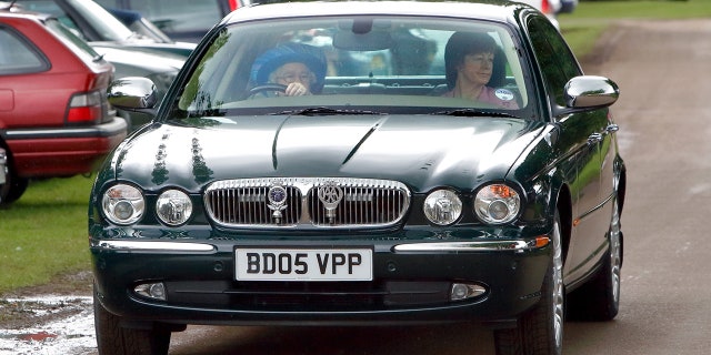 This Daimler features badges for RE (Regina Elizabeth) and The Automobile Association.