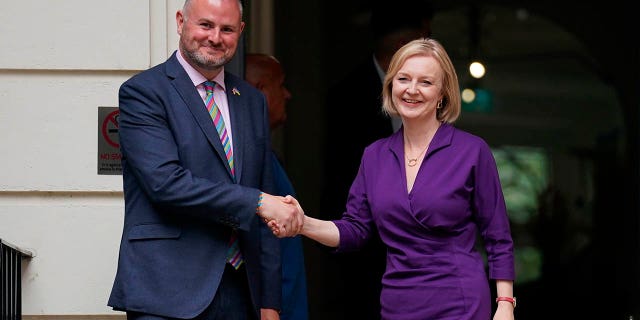 Liz Truss and Conservative Party chairman Andy Stephenson shake hands outside the Conservative Campaign Headquarters (CCHQ) following the announcement that she is the new Conservative party leader, and will become the next Prime Minister, in London, on Monday.