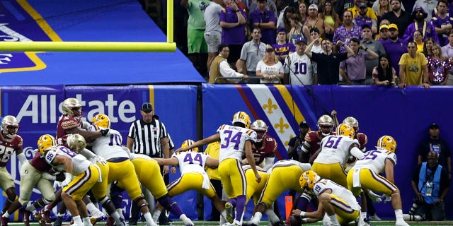 Place kicker Damian Ramos #34 of the LSU Tigers kicks the ball against the Florida State Seminoles at Caesars Superdome on September 04, 2022, in New Orleans, Louisiana.