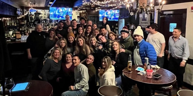 Kim Mahoney (far left, first row) and her staff at the Warren Tavern. "Ninety-eight percent of the kids who walk through the door have zero [job] experience," she said — but she gives them a chance. 