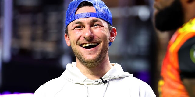 Johnny Manziel laughs on the field during Fan Controlled Football Season v2.0 - Week Seven on May 28, 2022 in Atlanta, Georgia. (Photo by Casey Sykes/Fan Controlled Football/Getty Images)