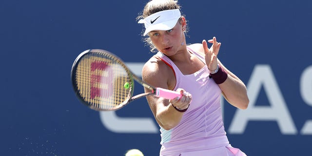 Marta Kostyuk of Ukraine plays a forehand against Victoria Azarenka during their Women's Singles Second Round match on Day Four of the 2022 US Open at USTA Billie Jean King National Tennis Center on September 01, 2022 in the Flushing neighborhood of the Queens borough of New York City .