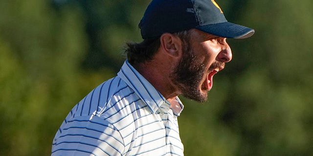 Max Homa celebrates winning the 18th hole during a four-ball match at the Presidents Cup at the Quail Hollow Club, Friday, Sept. 23, 2022, in Charlotte, N.C.