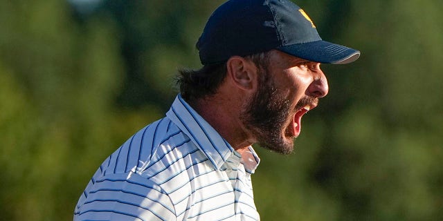 Max Homa celebrates winning the 18th hole during a four-ball match at the Presidents Cup at the Quail Hollow Club, Friday, Sept. 23, 2022, in Charlotte, N.C.