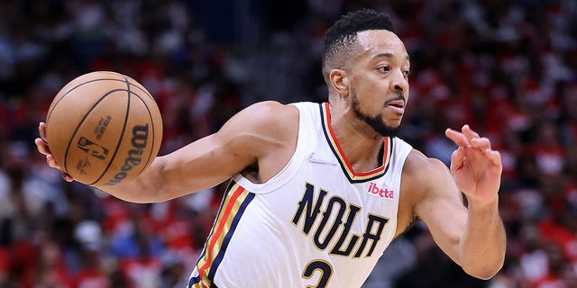CJ McCollum #3 of the New Orleans Pelicans drives with the ball against the Phoenix Suns during Game Four of the Western Conference First Round NBA Playoffs at the Smoothie King Center on April 24, 2022 in New Orleans, Louisiana. 