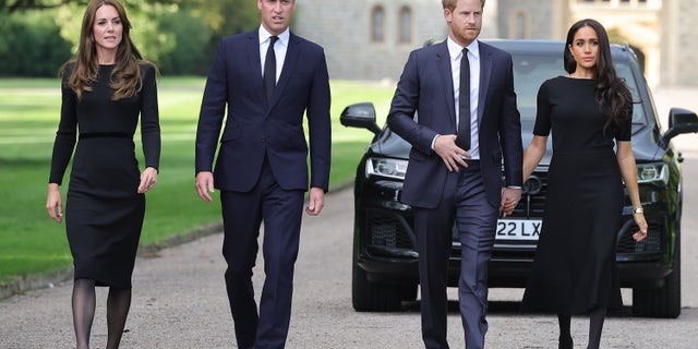 Catherine, Princess of Wales, Prince William, Prince of Wales, Prince Harry, Duke of Sussex, and Meghan, Duchess of Sussex on the long walk at Windsor Castle arrive to view flowers and tributes to Queen Elizabeth II.