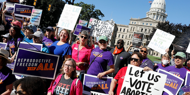 Pro-choice supporters gather outside the Michigan State Capitol during a "Restore Roe" rally in Lansing on Sept. 7, 2022.