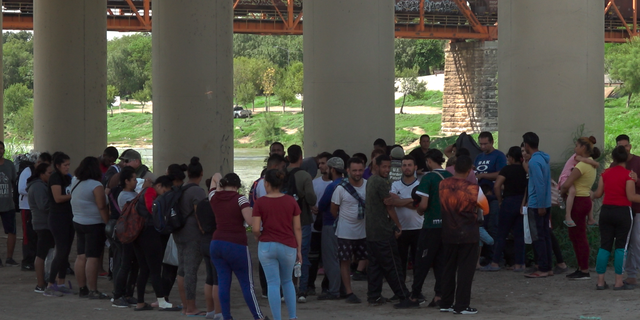 Customs and Border Protection agents process migrants who crossed into the U.S. through the Rio Grande.