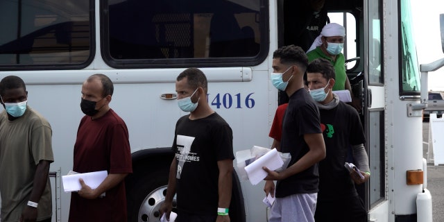 A Customs and Border Protection bus drops off dozens of migrants, mostly from Venezuela, at the City of El Paso's migrant welcome center on Sept. 22, 2022.