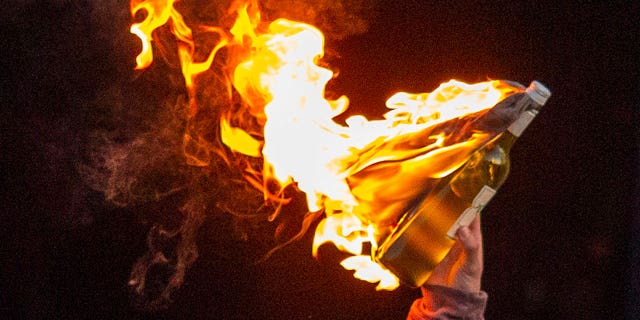 Justin Christopher Moore from Renton, Washington, pleaded guilty to possessing Molotov cocktails on Sept. 22, 2022. Pictured: A Molotov cocktail seen at a protest following the death of George Floyd in Los Angeles, California, on May 30, 2020.