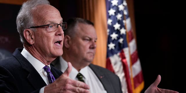 (L-R) Sen. Jerry Moran (R-KS) speaks as Sen. Jon Tester (D-MT) looks on during a news conference at the U.S. Capitol on Feb. 1, 2022 in Washington, D.C. (Photo by Drew Angerer/Getty Images)
