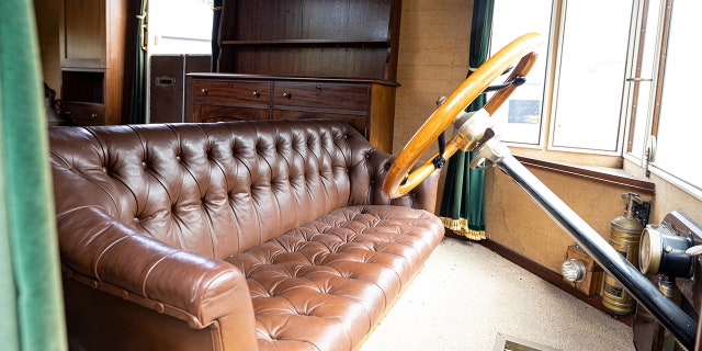 World's 'oldest' motorhome goes up for auction 3 The forward seat is a tufted leather sofa that can be turned around to face the living area.