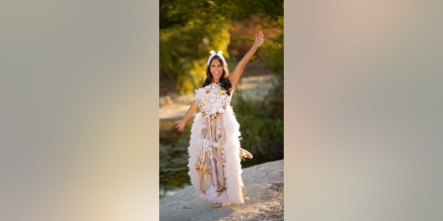 Mums were once worn via safety pin but now are worn around the neck with either string or a feather boa.