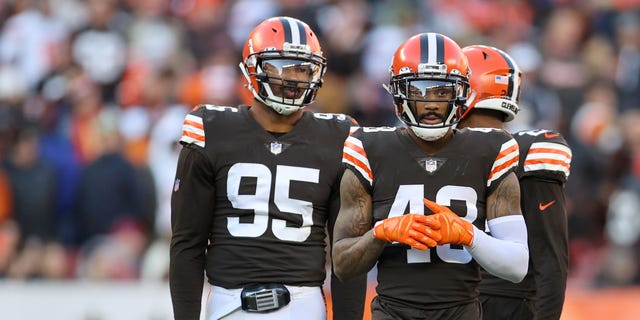 Browns defensive end Myles Garrett, left, and safety John Johnson during the Baltimore Ravens game on Dec. 12, 2021, at FirstEnergy Stadium in Cleveland, Ohio.