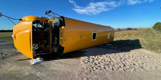 The bus driver and all 11 students, ages 6 to 15, on board were injured.
