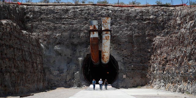 Nevada is pressuring the U.S. to finally scrap its already mothballed plan on how to dispose the country’s most hazardous nuclear waste. Pictured: People leaving the Yucca Mountain during a congressional tour on July 14, 2018, near Mercury, Nevada.
