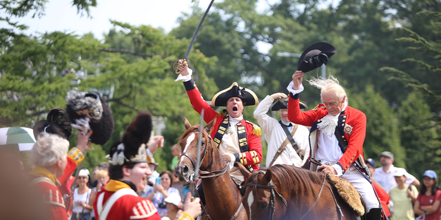 Redcoats offer cheer after re-enacting their victory in the Battle of Brooklyn. The 239th anniversary of the Battle of Brooklyn was reenacted in Green-Wood Cemetery in Brooklyn.