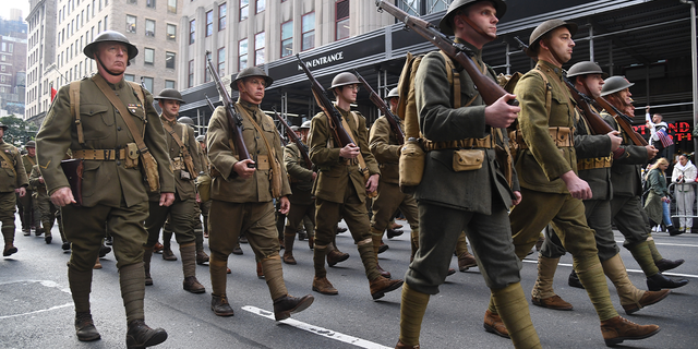  World War I military reenactors march in the Veterans Day Parade Nov. 11, 2019 in New York City. President Trump, the first sitting U.S. president to attend New York's parade, offered a tribute to veterans ahead of the 100th annual parade which draws thousands of vets and spectators from around the country.