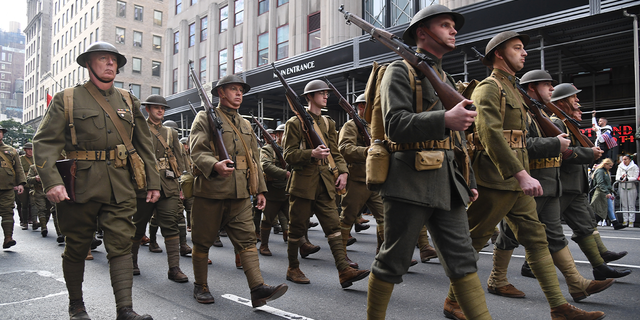  World War I military reenactors march in the Veterans Day Parade Nov. 11, 2019 in New York City. President Trump, the first sitting U.S. president to attend New York's parade, offered a tribute to veterans ahead of the 100th annual parade which draws thousands of vets and spectators from around the country.