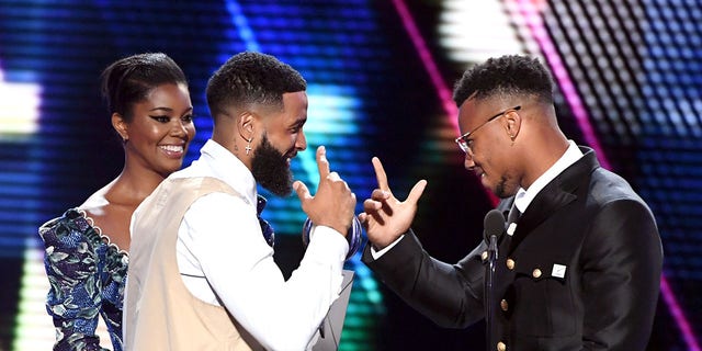 (LR) Gabrielle Union and Odell Beckham Jr. present the Best Breakthrough Athlete Award to Saquon Barkley on stage at the 2019 ESPY at the Microsoft Theater in Los Angeles on July 10, 2019.