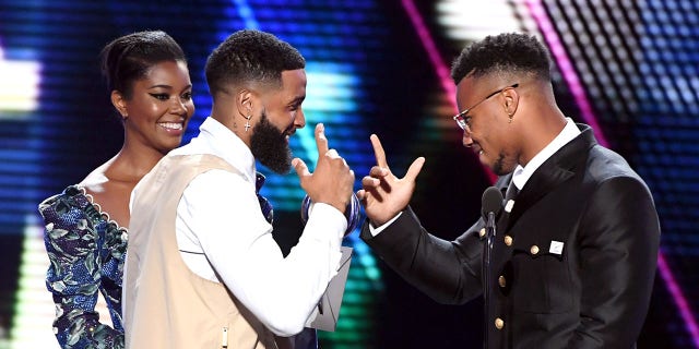 (LR) Gabrielle Union and Odell Beckham Jr. present the Best Breakthrough Athlete Award to Saquon Barkley on stage at the 2019 ESPY at the Microsoft Theater in Los Angeles on July 10, 2019.