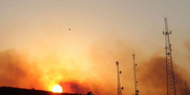 Eighteen fires are burning in Oregon and Washington, leading to evacuations and targeted power outages in Oregon.