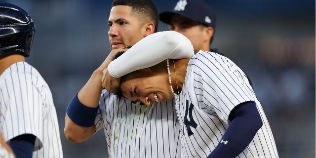 Gleyber Torres #25 and Oswaldo Cabrera #95 of the New York Yankees celebrate after Cabrera singled in the twelfth inning, sending Isiah Kiner-Falefa #12 home to defeat the Minnesota Twins at Yankee Stadium on Wednesday, Sept. 7, 2022 in New York, New York.