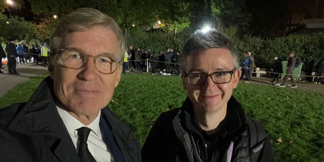 Greg Palkot takes a photo with producer Simon Owen after having seen Queen Elizabeth's coffin at Westminster Hall.