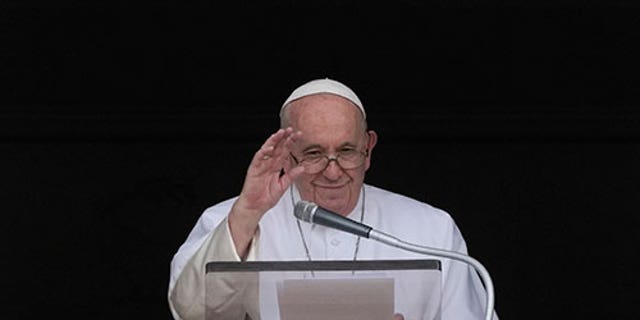 Pope Francis delivers his blessing as he recites the Angelus noon prayer from the window of his studio overlooking St.Peter's Square, at the Vatican, Sunday, Sept. 11, 2022. 