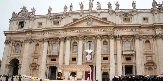 The tapestry depicting late Pope John Paul I hangs from St. Peter's Basilica during the beatification ceremony led by Pope Francis at the Vatican, Sunday, Sept. 4, 2022.