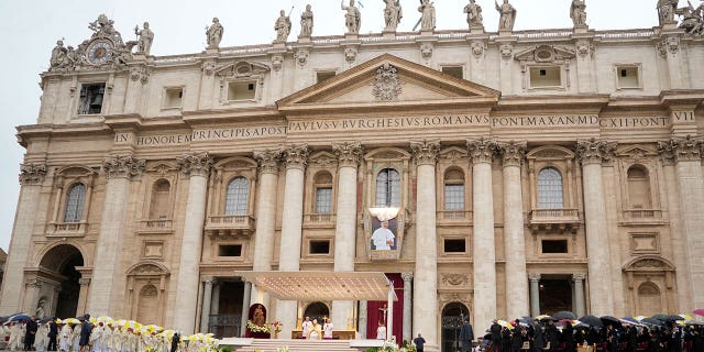 A tapestry depicting the late Pope John Paul I hangs in St. Peter's Basilica during Pope Francis' beatification ceremony at the Vatican, Sunday, Sept. 4, 2022.