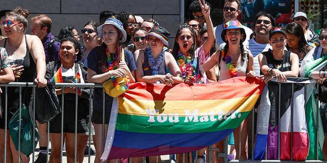 People carry the rainbow flag during the 51st Annual LGBTQ Pride Parade in Chicago, Illinois on June 26, 2022. 