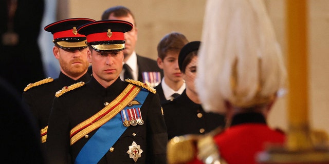 Prince Harry and Prince William joined the rest of Queen Elizabeth II's grandchildren to stand vigil at the queen's coffin on Saturday.