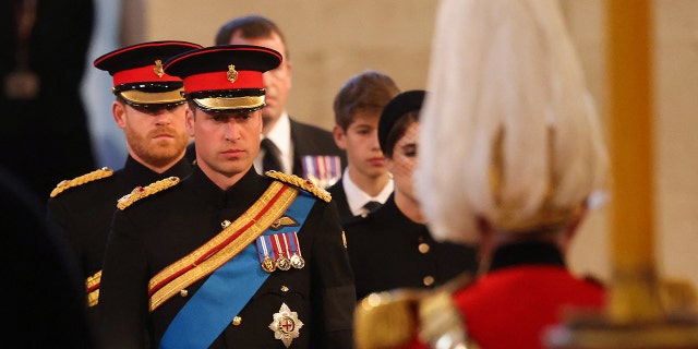 Prince Harry and Prince William joined the rest of Queen Elizabeth II's grandchildren to stand vigil at the queen's coffin on Saturday.