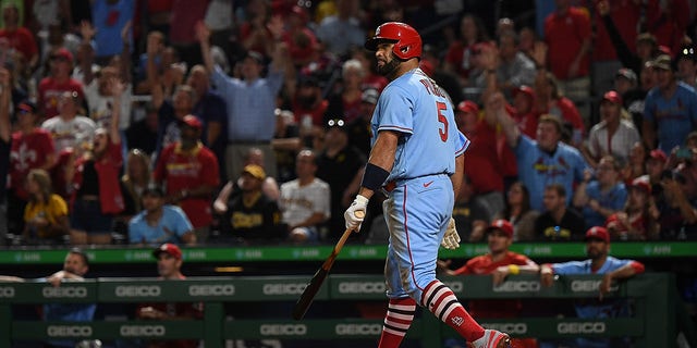 Albert Pujols #5 of the St. Louis Cardinals watches as his two run home run goes over the wall in the sixth inning during the game against the Pittsburgh Pirates at PNC Park on September 10, 2022 in Pittsburgh, Pennsylvania. The Home Run was the 696th of Pujols Career.