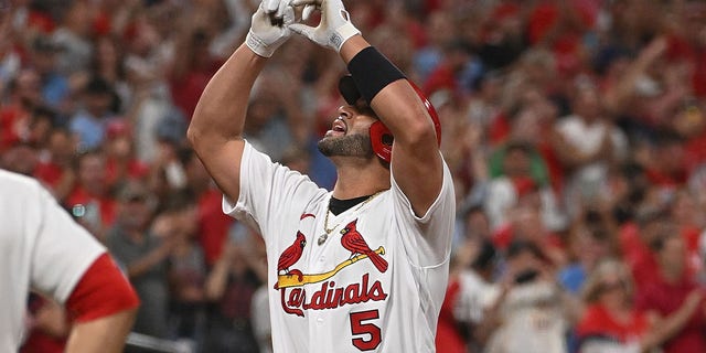 Albert Pujols #5 of the St. Louis Cardinals reacts after hitting a two-run home run against the Cincinnati Reds in the sixth inning at Busch Stadium on September 16, 2022 in St Louis, Missouri.