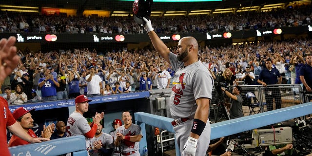 St. Louis Cardinals designated hitter Albert Pujols (5) celebrates after hitting a home run during the fourth inning of a baseball game against the Los Angeles Dodgers in Los Angeles, Friday, Sept. 23, 2022. Brendan Donovan and Tommy Edman also scored. It was Pujols' 700th career home run.