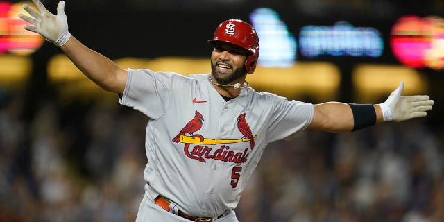 St. Louis Cardinals designated hitter Albert Pujols (5) reacts after hitting a home run during the fourth inning of a baseball game against the Los Angeles Dodgers in Los Angeles, Friday, Sept. 23, 2022. Brendan Donovan and Tommy Edman also scored. It was Pujols' 700th career home run.