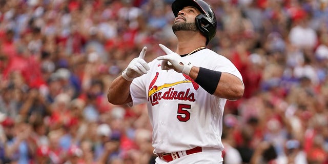 St. Louis Cardinals' Albert Pujols celebrates after hitting a two-run home run during the eighth inning against the Chicago Cubs on Sept. 4, 2022, in St. Louis.